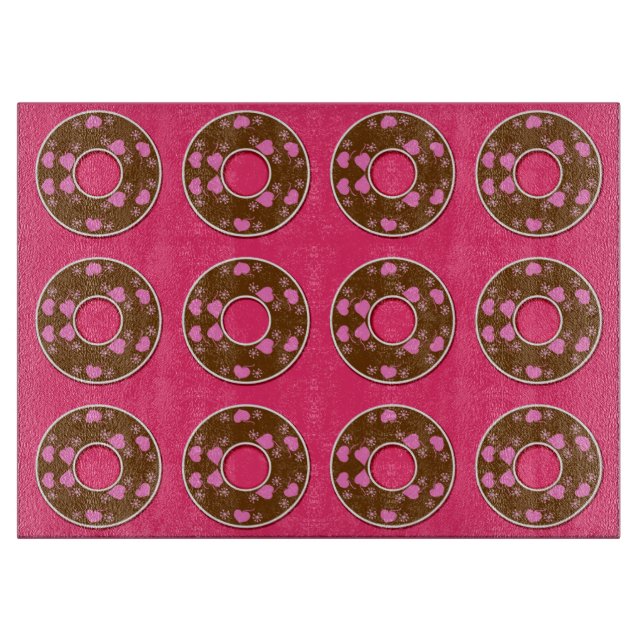 Chocolate donuts on hot pink cutting board (Front)