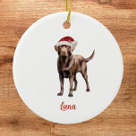 Chocolate Lab Christmas Ornament<br><div class="desc">Celebrate the joy of the season with a touch of furry charm! This Custom Chocolate Lab Christmas Ornament is the perfect way to honor your beloved four-legged friend this holiday season. Crafted with care, this ornament features a festive brown Labrador Retriever, complete with Santa hat. What makes this ornament truly...</div>