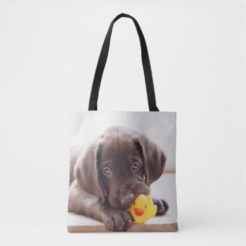 Chocolate Labrador Puppy With Toy Duck Tote Bag