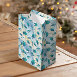 Christmas Beach Sea Turtle Glitter Sparkle Medium Gift Bag<br><div class="desc">These coastal themed Christmas gift bags feature a pattern of cute turquoise blue sea turtles on an abstract beach background with a faux glitter wave and sparkly star accents. Check out the collection for more matching products,  or contact me through Zazzle Chat if you need something special.</div>