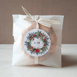 Christmas Berries | Monogram Holiday Wedding Classic Round Sticker<br><div class="desc">These stylish holiday wedding stickers feature a watercolor pine wreath design,  complete with pine cones,  green foliage,  red Christmas holly berries,  and cream colored and red flowers. Add your initials or monogram in the center.</div>