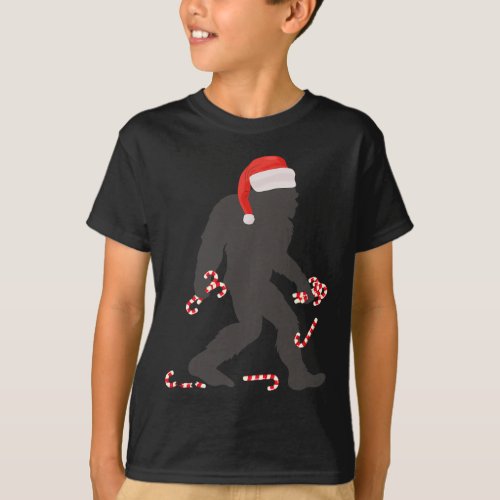 Christmas Bigfoot With Santa Hat Carrying Candy Ca T_Shirt