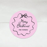 Christmas Bow | Wavy Blush Pink and Black Classic Round Sticker<br><div class="desc">These adorable coquette holiday stickers feature a trendy,  black wavy frame with a whimsical retro ribbon bow,  on a chic blush pink background. Modern script says "Merry Christmas."</div>