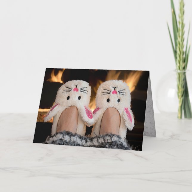 Christmas bunny slippers by fire holiday card (Front)