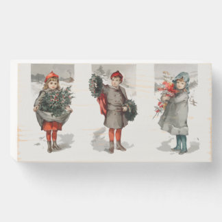 Christmas card depicting children and holly wooden box sign