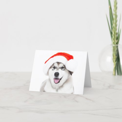 CHRISTMAS CARD HUSKY PUPPY WITH A SANTA HAT