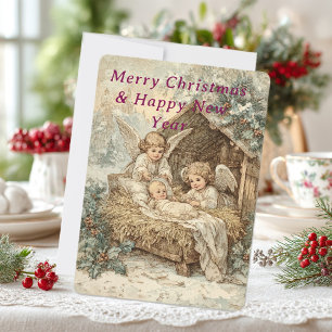 Christmas card with baby Jesus in a manger 