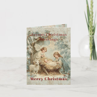 Christmas card with baby Jesus in a manger and ang