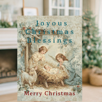 Christmas card with baby Jesus in a manger and ang