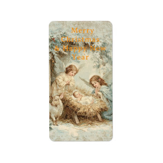 Christmas card with baby Jesus in a manger and ang Label