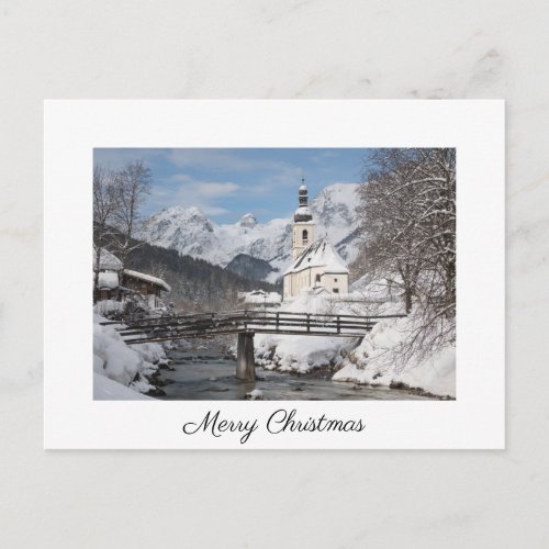 Christmas card with church in the snow in the Alps