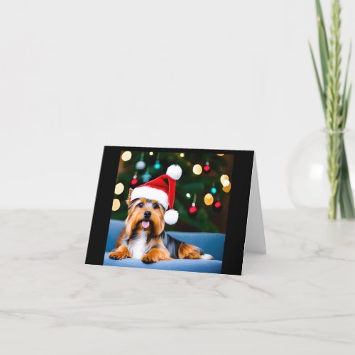 Christmas card with Yorkshire terrier in Santa hat