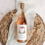 Christmas Crest | Whimsical Holiday Wedding Wine Label<br><div class="desc">These stunning,  vintage style holiday wedding wine labels feature a colorful,  whimsical Christmas design. A bright red crest with your monogram and a bow is surrounded by watercolor green botanical foliage,  and modern handwritten script says "cheers."</div>