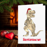 Christmas Dinosaur T-Rex Santa Card<br><div class="desc">Time for a roaring prehistoric Christmas with this Funny roaring Santa Tyrannosaurus Rex Christmas Dinosaur. Better make sure you’re not in the naughty category or T-Rex Santa will be after you. Fun xmas T-Rex dinosaur wearing a cute Santa hat, the perfect way to bring fun and laughter to your family...</div>