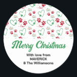 Christmas DOG PAW PRINTS Personalized Family Classic Round Sticker<br><div class="desc">Christmas DOG PAW PRINTS Personalized Family Festive Sticker, with CUSTOMIZABLE TEXT, designed to giftwrap your special pet present for your favorite fur baby. The design shows paw prints with hearts in Christmas color palette with festive elements. PERSONALIZE your greeting and add your family name(s). This paws and hearts Sticker would...</div>