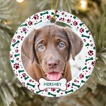 Christmas Dog Paw Prints Personalized Pet Photo Ceramic Ornament<br><div class="desc">Decorate your tree or give a special gift this holiday season with this elegant pet photo design christmas ornament, and matching decor. This dog christmas ornament features a festive green and red paw prints and bones pattern. Personalize with name front and year . This pet christmas ornament will be a...</div>