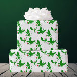 Christmas Dragon in Santa Hats Cool Fantasy Wrapping Paper<br><div class="desc">Three cool green Christmas Dragons flying around in red Santa hats. Their outstretched wings make them look like holiday holly. Awesome wrapping paper for a dragon item collector.</div>