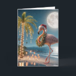 Christmas Flamingo Wearing a Santa Hat Card<br><div class="desc">A festive flamingo wearing a Santa hat and wreath stands on a tropical beach under a full moon 
All text can be changed.</div>