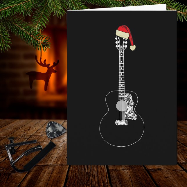 Christmas Guitar cool minimalistic black and white Card (Simple black and white christmas guitar wearing a Santa hat music themed holiday greetings card)
