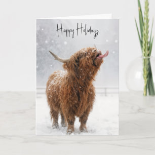 Christmas Highland Cow Licking Snowflakes Card