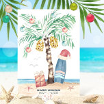 Christmas Island Surf Santa Tropical Beach Holiday Card<br><div class="desc">Beach theme Christmas card features a palm tree Christmas tree (decorated with ornaments and lights) on a tropical island with a Santa hat perched on a surfboard, a present, starfish, ocean waves, sea birds and a "Warm Wishes" holiday greeting. The greeting and name can be personalized. Art by KL Stock...</div>