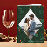 Christmas Kiss Mistletoe Romantic Photo Folded Holiday Card<br><div class="desc">Christmas kisses and holiday wishes abound with this festive and romantic mistletoe folded holiday card. Fill the elegant diamond with your favorite couple kiss photo and add your custom Xmas message in white over the botanical green background. A beautiful mistletoe hangs over your kissing photograph. Add a 2nd picture inside...</div>