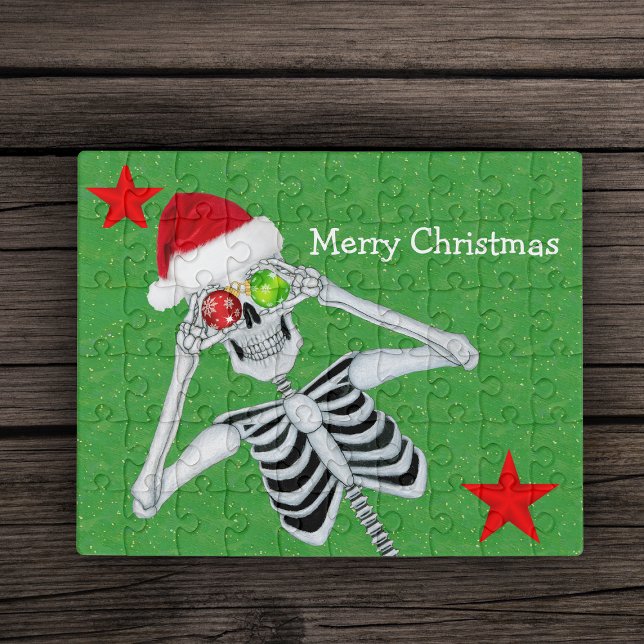 Christmas Laughing Skeleton Ornament Eyes Stars  Jigsaw Puzzle (Laughing Merry Christmas Skeleton ornament eyes red stars on green jigsaw puzzle.)