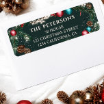 Christmas lights pine branches snow green festive label<br><div class="desc">This elegant return address label features a festive pine garland design adorned with red and teal ornaments, pinecones, and twinkling lights, set against a rich green background. Perfect for adding a touch of holiday cheer to your Christmas cards, invitations, or packages. Personalize with your family name and address for a...</div>