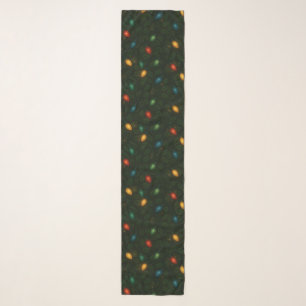Christmas lights wrapped in holly leaves patterned scarf