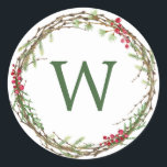 Christmas Monogram Winter Greenery Wreath Berries Classic Round Sticker<br><div class="desc">Rustic monogrammed winter greenery leaves berries wreath Christmas envelope seal or gift sticker. Simply customize the Christmas label by adding your monogram initial. Modern and simple,  red and green Christmas theme. Exclusively designed for you by Happy Dolphin Studio. If you need any help please contact us at happydolphinstudio@outlook.com.</div>