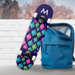 Christmas Ornaments Baubles Patterned Monogrammed Skateboard<br><div class="desc">Bring a colorful flourish to your skateboarding sessions, with this bright and festive board. With a pattern of Christmas ornaments in pink, blue and green on a midnight blue background, this board is sure to shine at the skate park. The board can be personalized with an initial as an elegant...</div>