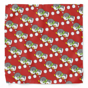 Christmas penguin getting a snow ball bandana