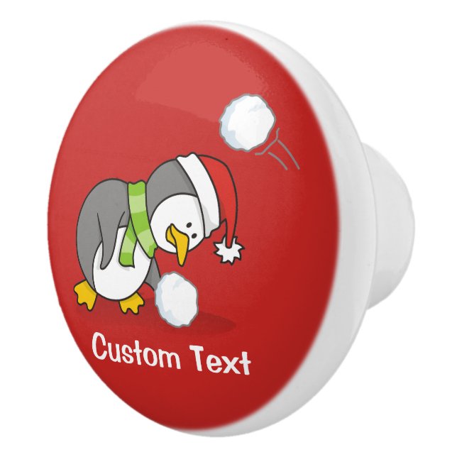 Christmas penguin getting a snow ball ceramic knob (Right)