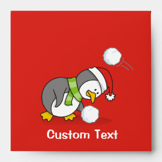 Christmas penguin getting a snow ball envelope