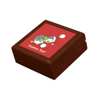 Christmas penguin getting a snow ball jewelry box