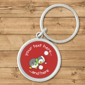 Christmas Penguin Getting a Snow Ball Keychain