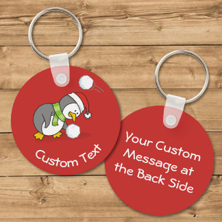 Christmas Penguin Getting a Snow Ball Keychain