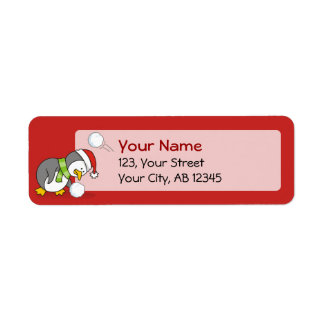 Christmas penguin getting a snow ball label