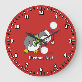 Christmas penguin getting a snow ball large clock