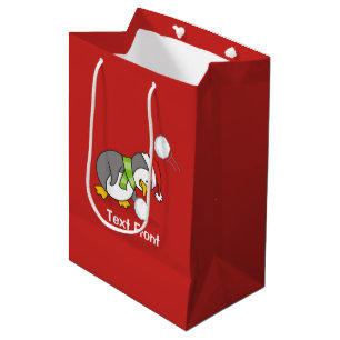 Christmas penguin getting a snow ball medium gift bag