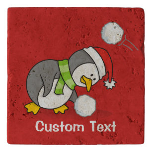 Christmas penguin getting a snow ball trivet