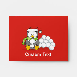 Christmas penguin sitting with snow balls envelope