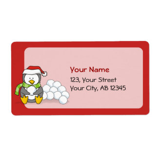 Christmas penguin sitting with snow balls label