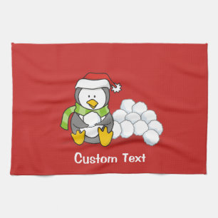 Christmas penguin sitting with snow balls towel