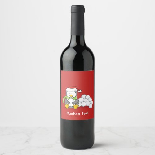 Christmas penguin sitting with snow balls wine label