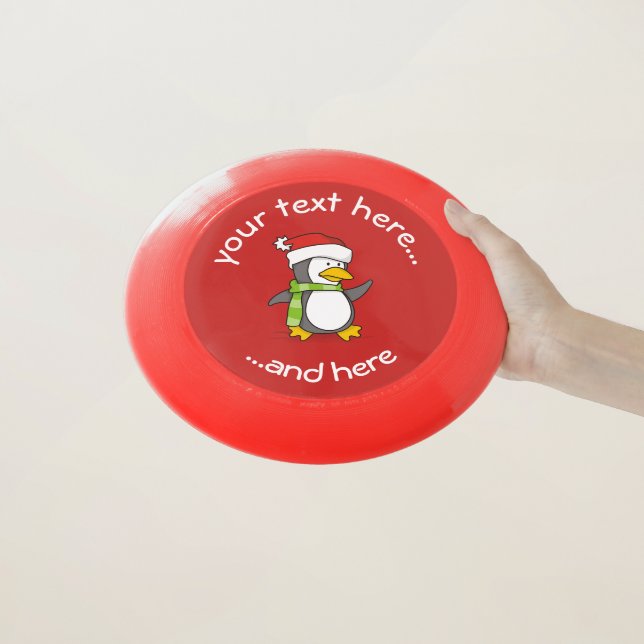 Christmas penguin walking on snow Wham-O frisbee (In Hand)
