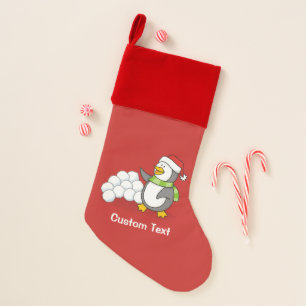 Christmas penguin with snow balls waving stocking
