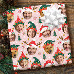 Christmas Photo Collage Festive Funny Face Pink Wrapping Paper<br><div class="desc">Make your gifts stand out this holiday season with custom photo wrapping paper! This fun face-in-a-hole template is personalized with five of your favorite photos set inside whimsical hat frames. Featuring festive Santa hats, cute elf styles, and reindeer antlers, with a background of Christmas trees, berries, snowflakes, and stars. This...</div>