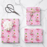 Christmas Pink Flamingo Pattern Wrapping Paper Sheets<br><div class="desc">Pink Christmas flamingos wearing string lights and a Santa hat on a pink background with snowflakes and festively decorated palm trees. Shown here on customizable gift wrapping paper sheets. You can easily resize the pattern to your preference and select your favorite background color on each sheet of gift wrap. It's...</div>