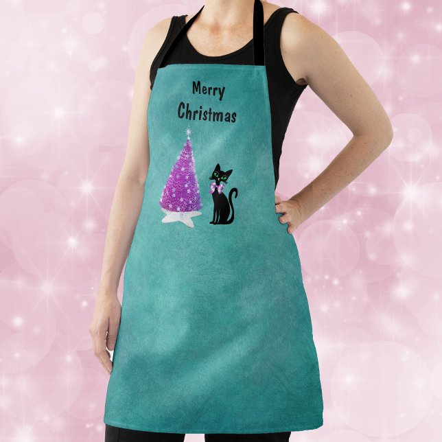 Christmas Pink Silver Tree Star Rug Black Cat Teal Apron (Pink silver tree on star rug with black cat wearing pink bow on teal Christmas kitchen apron.)